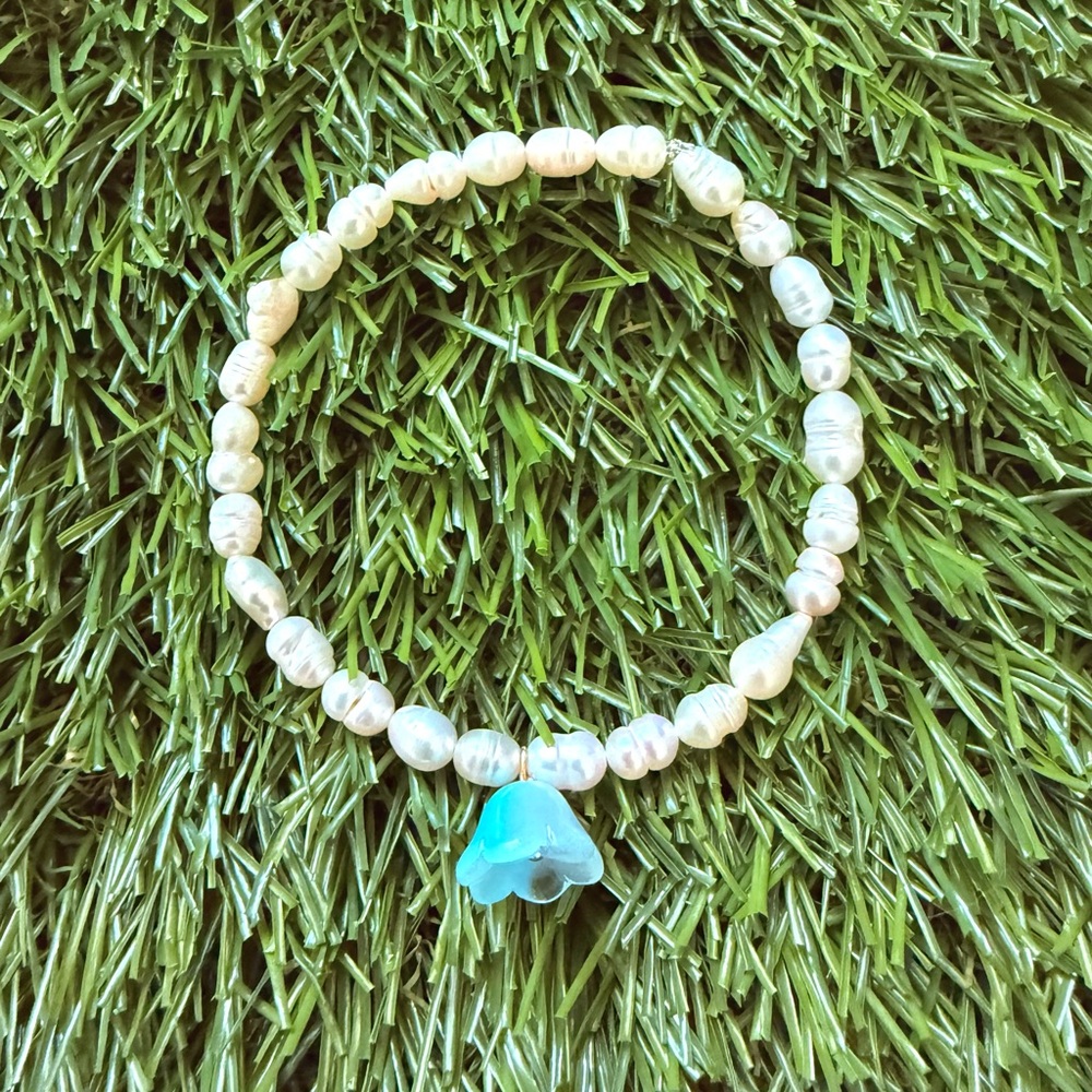 Elegant Pearl Bracelet with Blue Charm